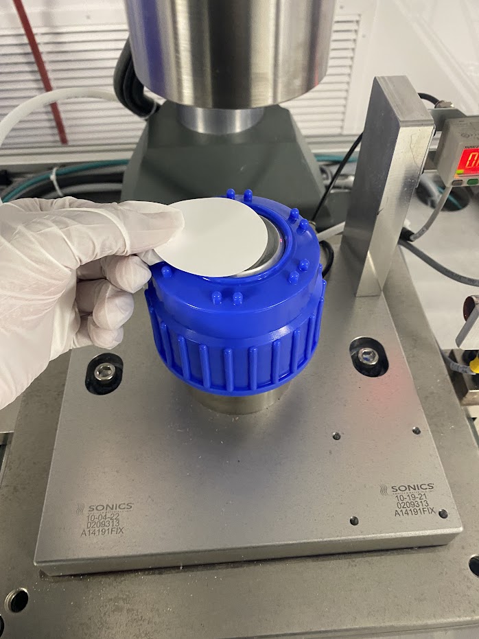 Operator placing filter by eye in original process